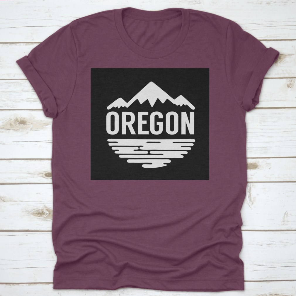 Cotton t-shirt featuring white silhouettes of mountains and water, representing Oregon's natural beauty.