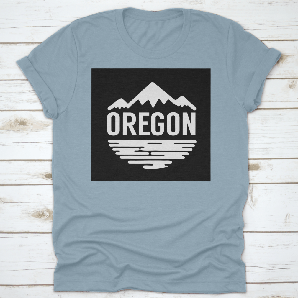 Cotton t-shirt featuring white silhouettes of mountains and water, representing Oregon's natural beauty.