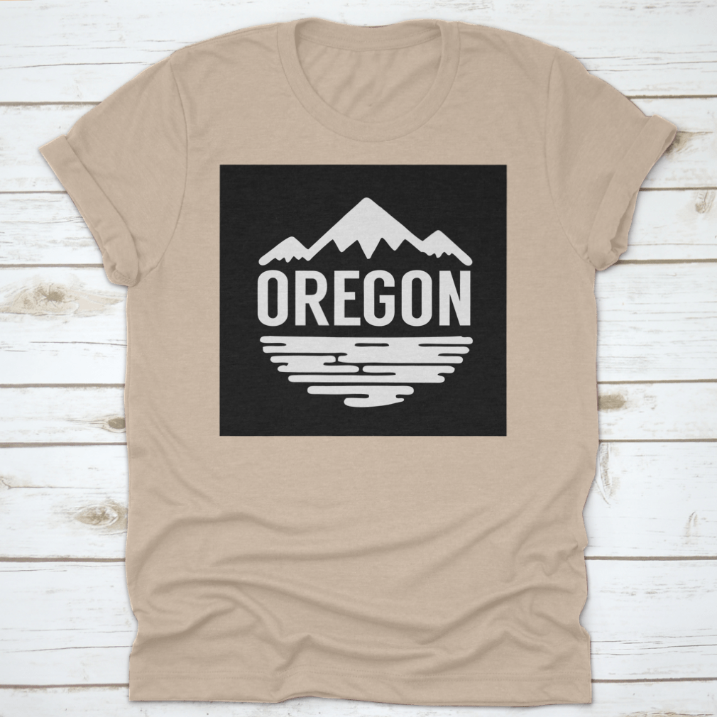 Cotton t-shirt featuring white silhouettes of mountains and water, representing Oregon's natural beauty.