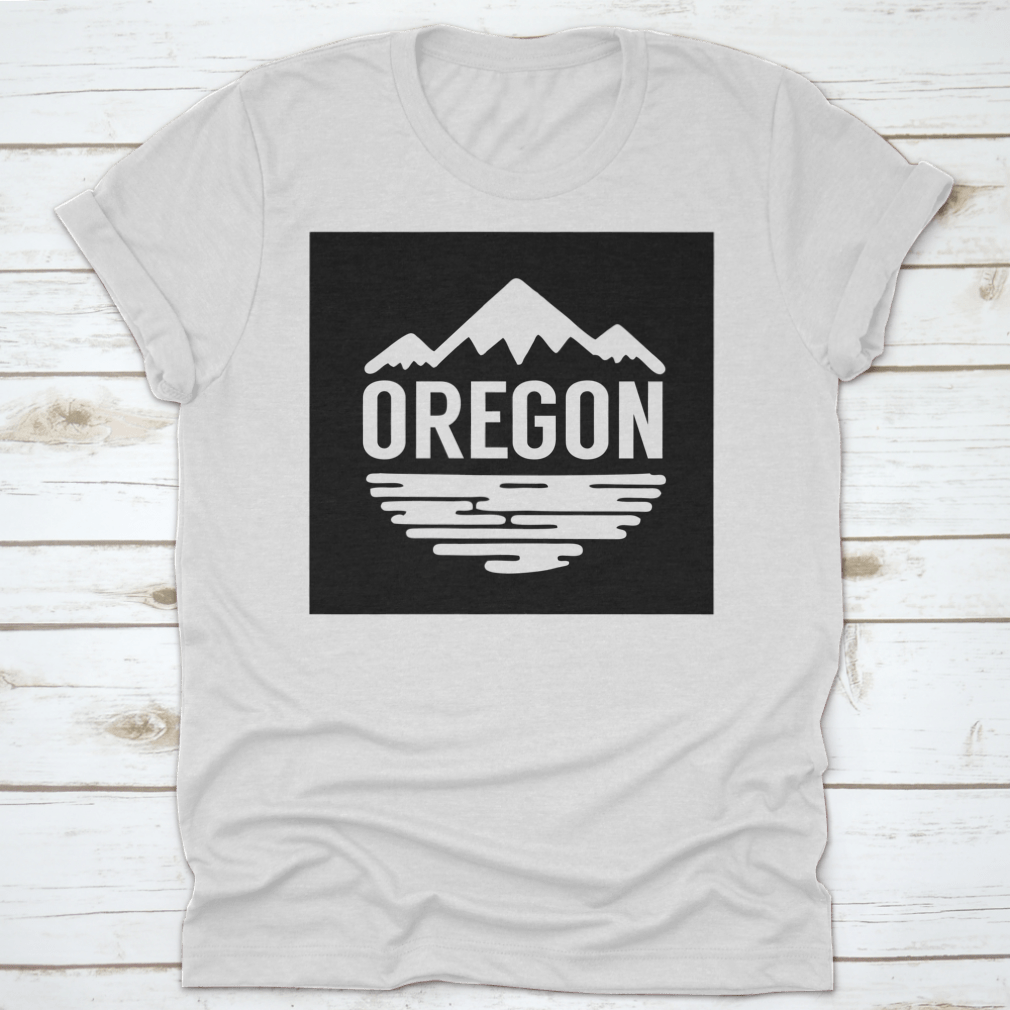 Cotton t-shirt featuring white silhouettes of mountains and water, representing Oregon's natural beauty.