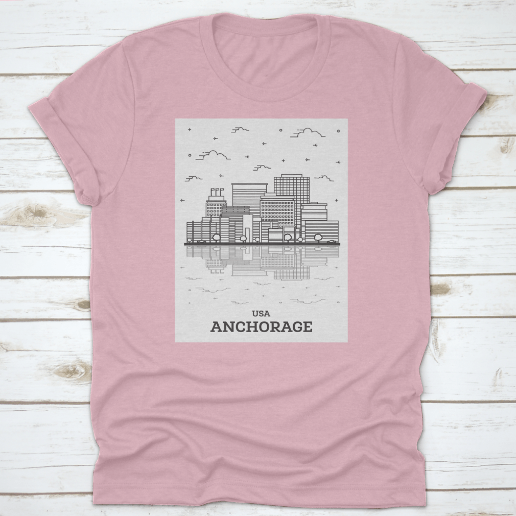 A stylish t-shirt featuring the skyline of Anchorage, Alaska, showcasing modern buildings against a clear sky.