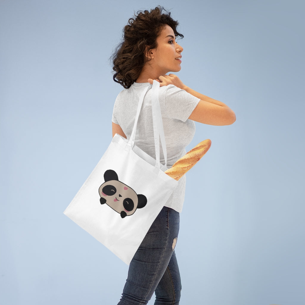 A stylish Panda Tote Bag made of 100% cotton with long handles and cross-stitched design, available in various colors.