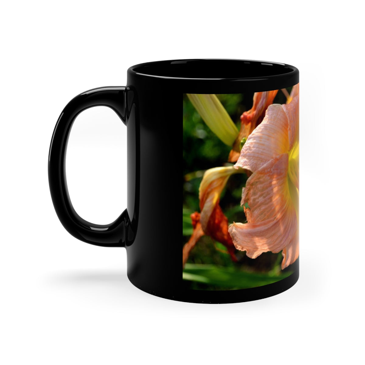 Peach and yellow flower design on a black ceramic mug, perfect for coffee or tea.