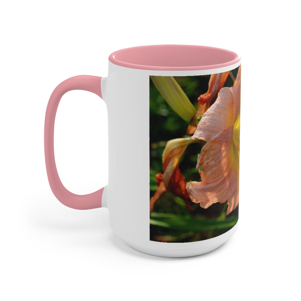 A ceramic mug featuring a peach and yellow flower design with a white exterior and colored interior, showcasing its vibrant colors and comfortable C-handle.