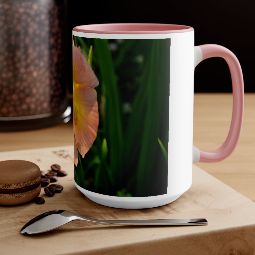 A ceramic mug featuring a peach and yellow flower design with a white exterior and colored interior, showcasing its vibrant colors and comfortable C-handle.