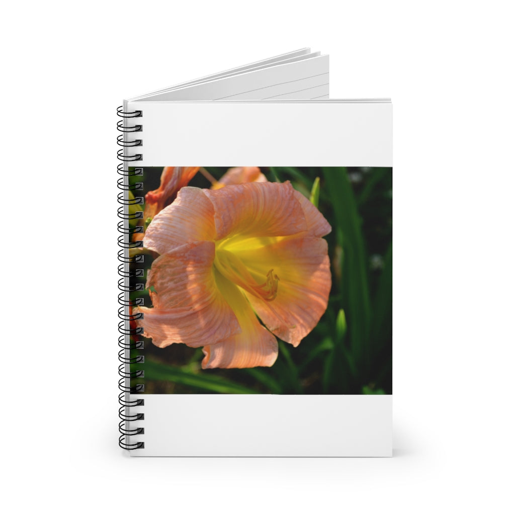 Peach and yellow flower spiral notebook with ruled line pages and a durable printed cover.