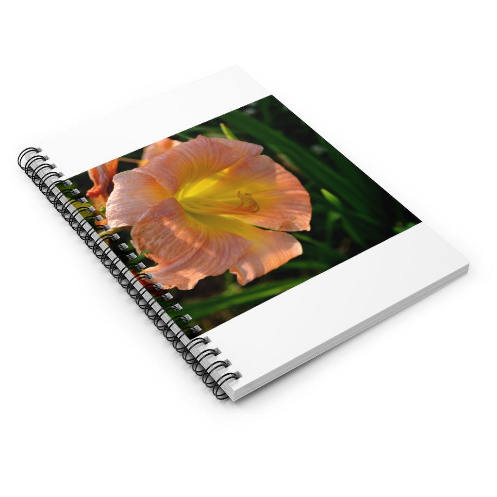 Peach and yellow flower spiral notebook with ruled line pages and a durable printed cover.