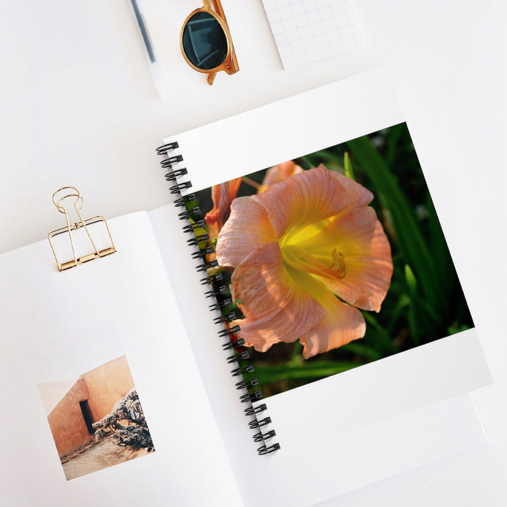 Peach and yellow flower spiral notebook with ruled line pages and a durable printed cover.