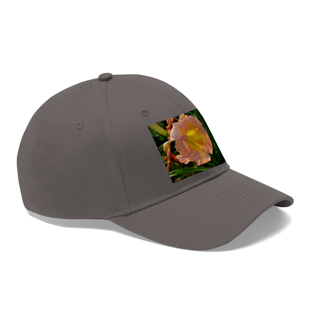 Peach and yellow flower unisex twill hat with adjustable Velcro closure and classic 6-panel design.