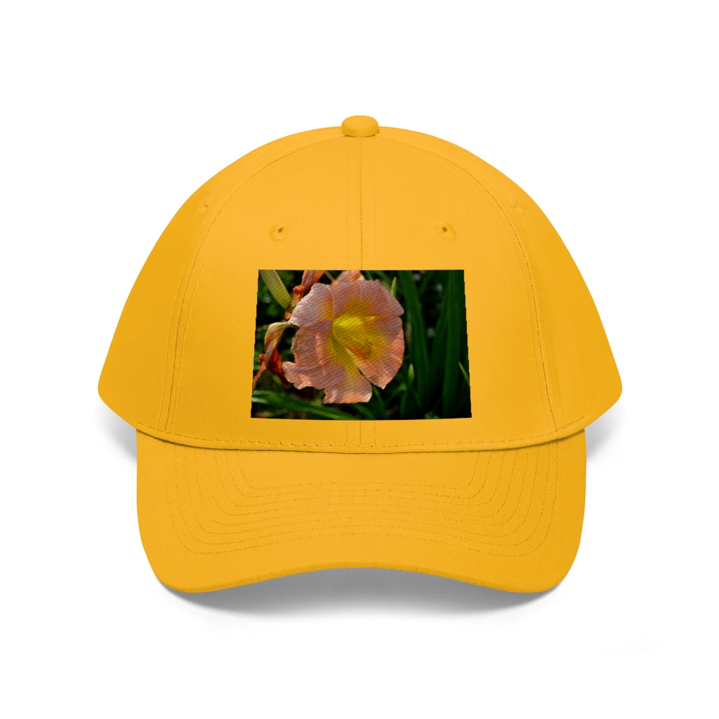 Peach and yellow flower unisex twill hat with adjustable Velcro closure and classic 6-panel design.