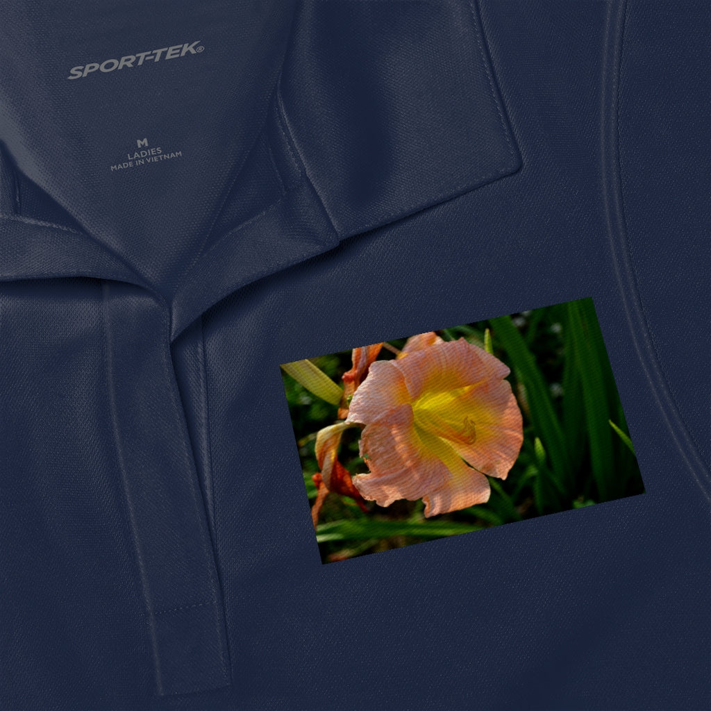 A stylish Peach and Yellow Flower Women's Polo Shirt featuring a lightweight design and tapered neck, perfect for various occasions.