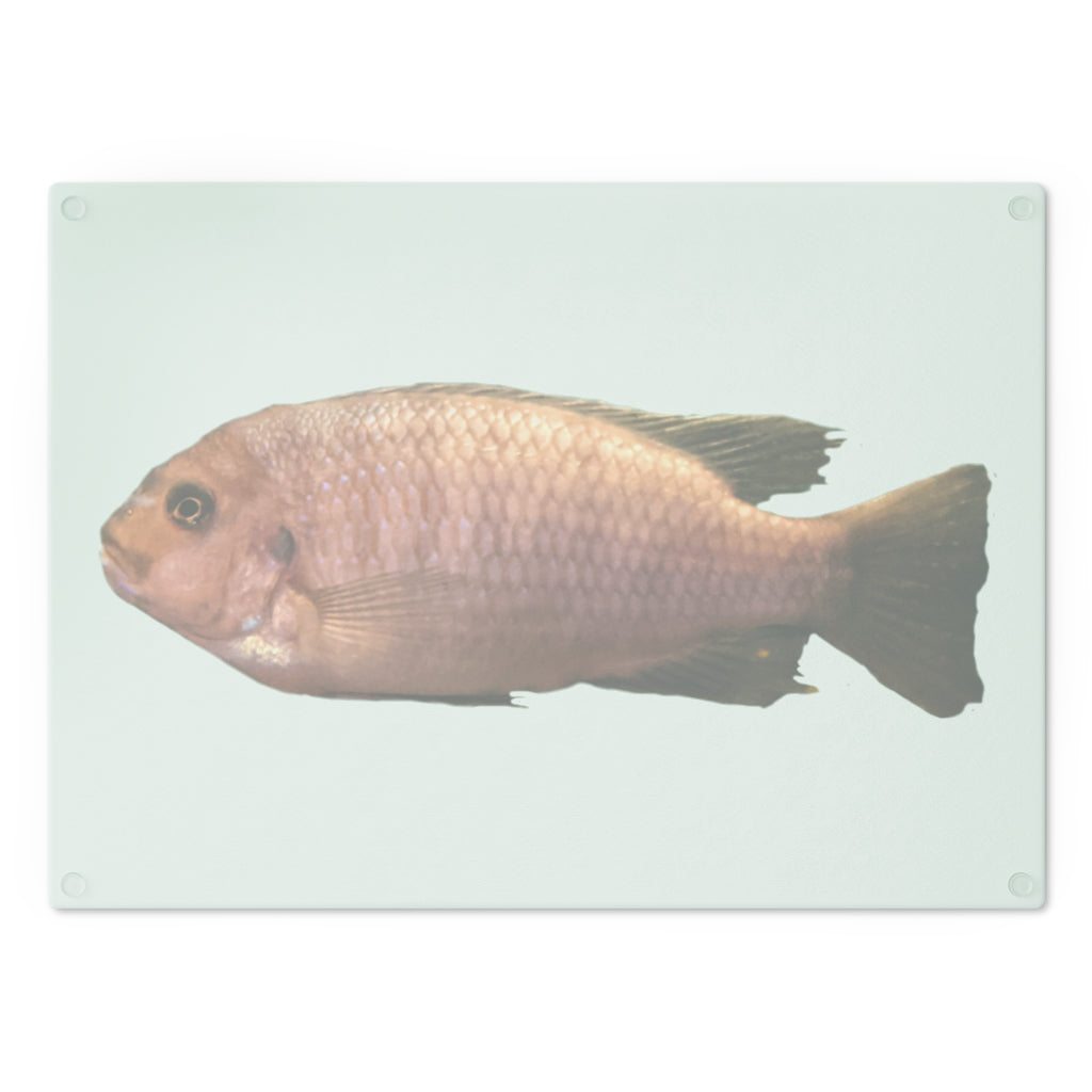 A stylish Peach Fish Cutting Board made of tempered glass, featuring a vibrant peach fish design and four rubber dots for stability.