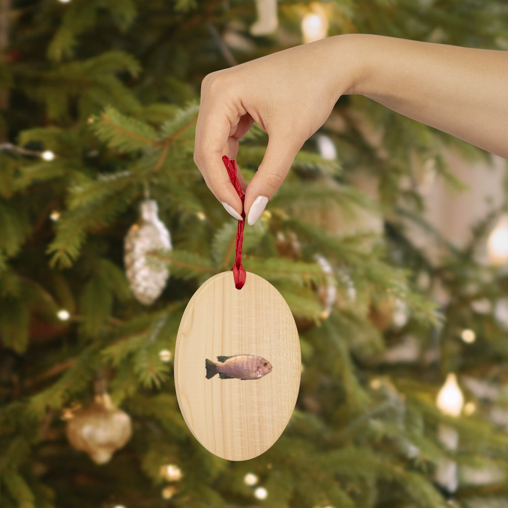 A collection of Peach Fish Wooden Christmas Ornaments in various whimsical shapes, featuring a rustic wooden finish and red ribbons for hanging.