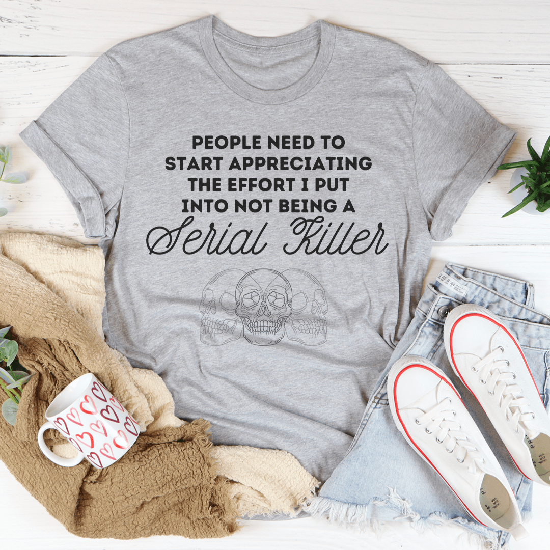 A stylish black t-shirt with the phrase 'People Need To Start Appreciating Me' printed in bold letters, showcasing its soft fabric and double stitching.