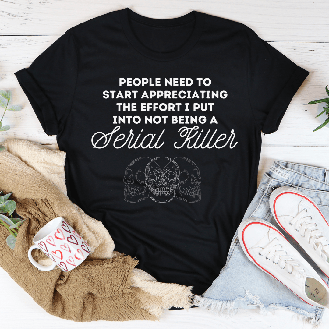 A stylish black t-shirt with the phrase 'People Need To Start Appreciating Me' printed in bold letters, showcasing its soft fabric and double stitching.