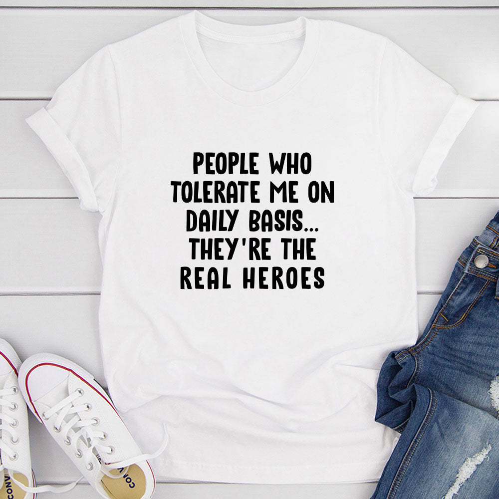 A humorous t-shirt featuring the phrase 'People Who Tolerate Me On Daily Basis' printed on soft cotton fabric, showcasing its durability and comfort.