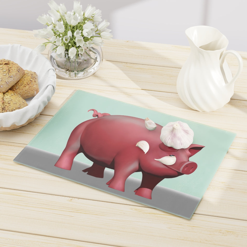 A stylish Pig Cutting Board made of tempered glass, featuring a charming pig design and rubber dots for stability.