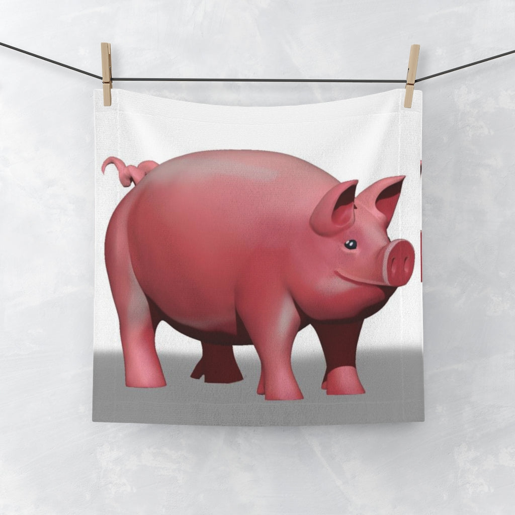 A colorful pig face towel featuring a vibrant design on a polyester front and soft cotton back, perfect for bathroom use.