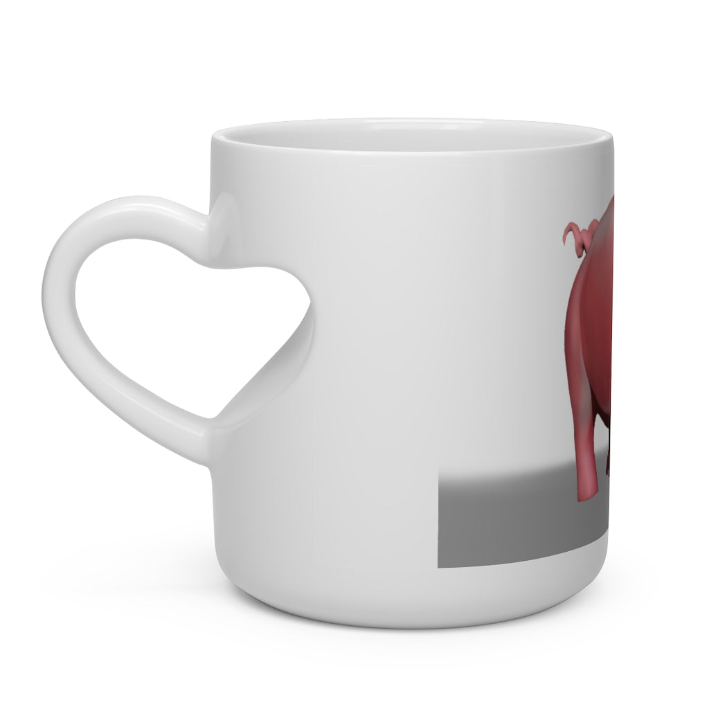 A white ceramic mug shaped like a heart with a heart-shaped handle, perfect for hot beverages.