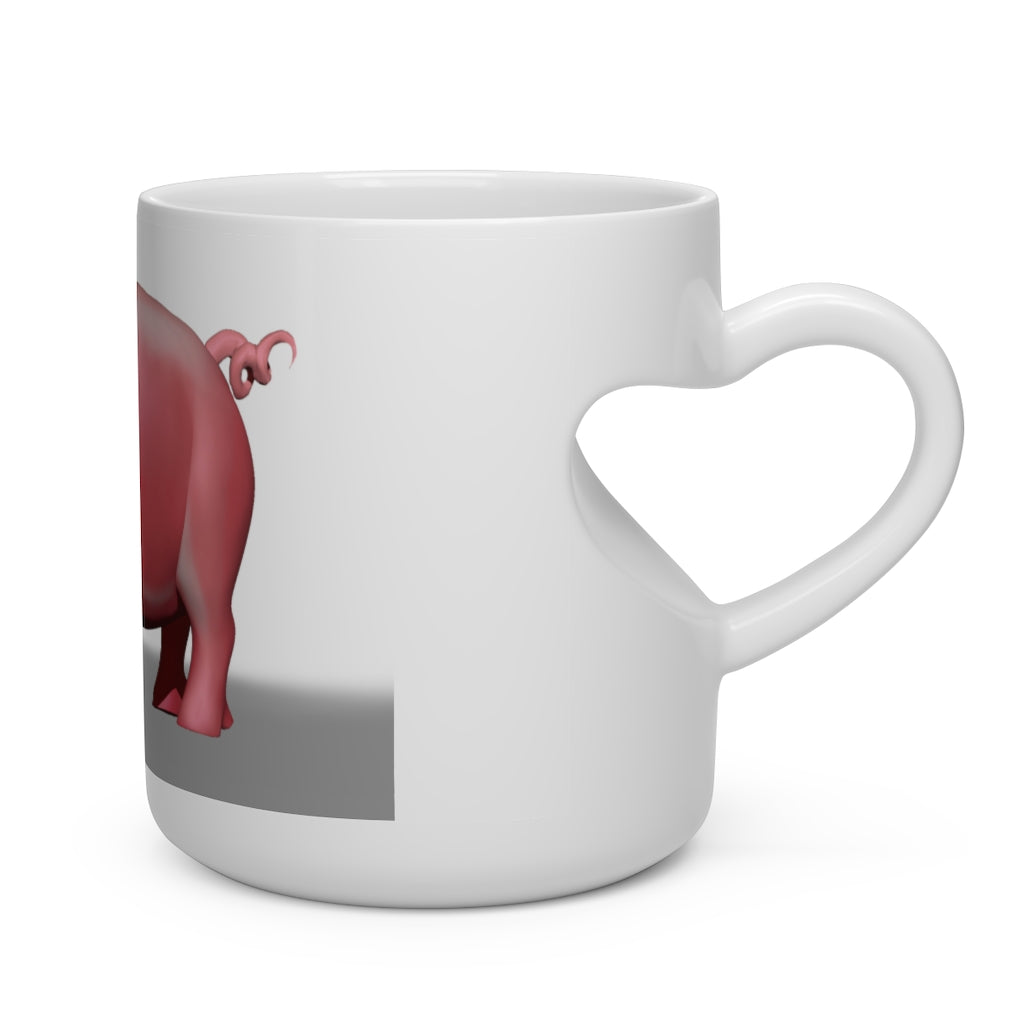 A white ceramic mug shaped like a heart with a heart-shaped handle, perfect for hot beverages.