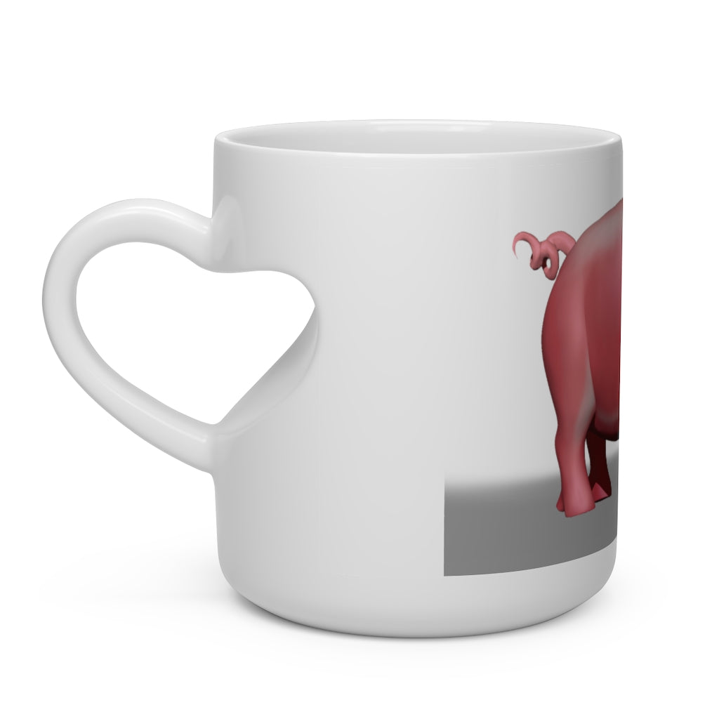 A white ceramic mug shaped like a heart with a heart-shaped handle, perfect for hot beverages.