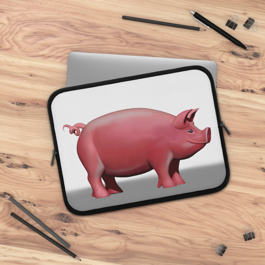 A stylish Pig Laptop Sleeve featuring a customizable front design and a black polyester back, ideal for protecting laptops during travel.