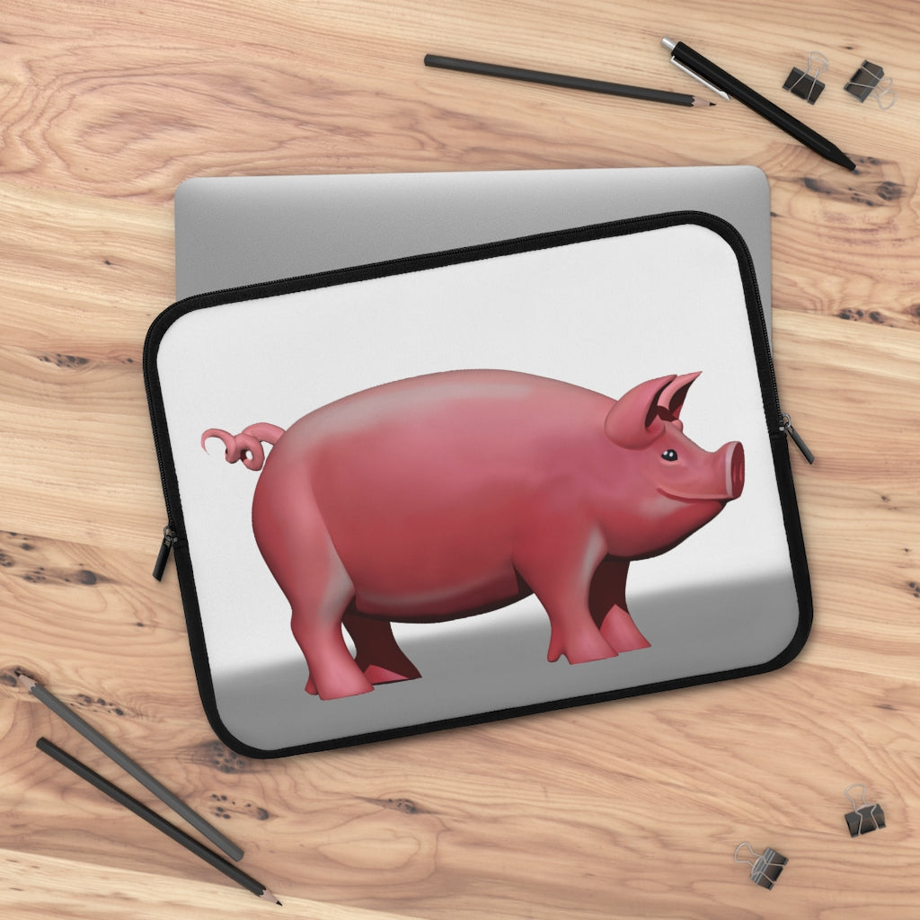 A stylish Pig Laptop Sleeve featuring a customizable front design and a black polyester back, ideal for protecting laptops during travel.