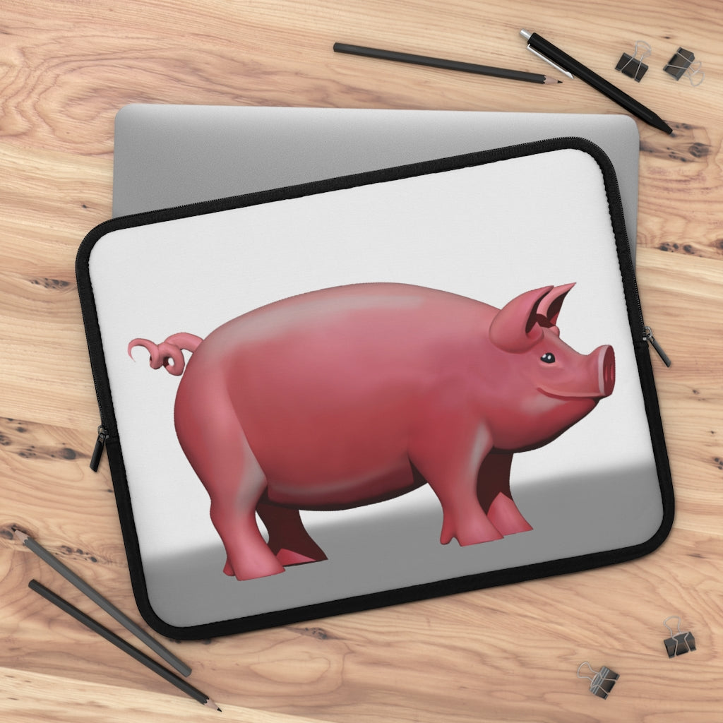 A stylish Pig Laptop Sleeve featuring a customizable front design and a black polyester back, ideal for protecting laptops during travel.