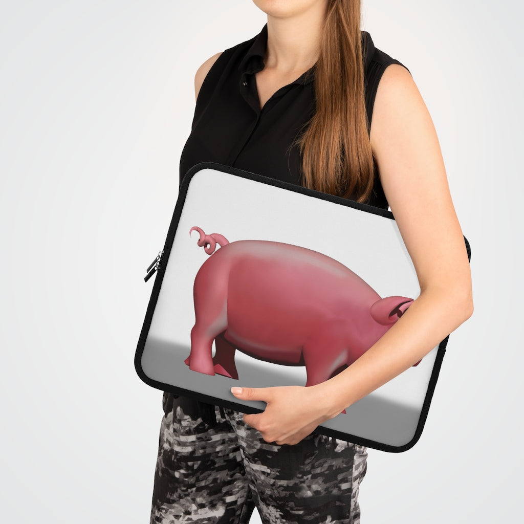 A stylish Pig Laptop Sleeve featuring a customizable front design and a black polyester back, ideal for protecting laptops during travel.