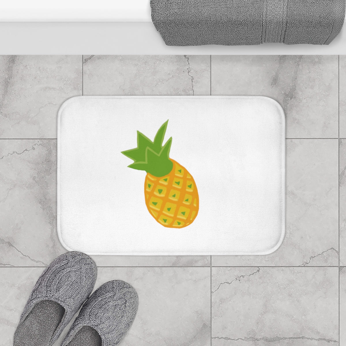 A vibrant pineapple bath mat with anti-slip backing, showcasing a tropical design perfect for bathroom decor.