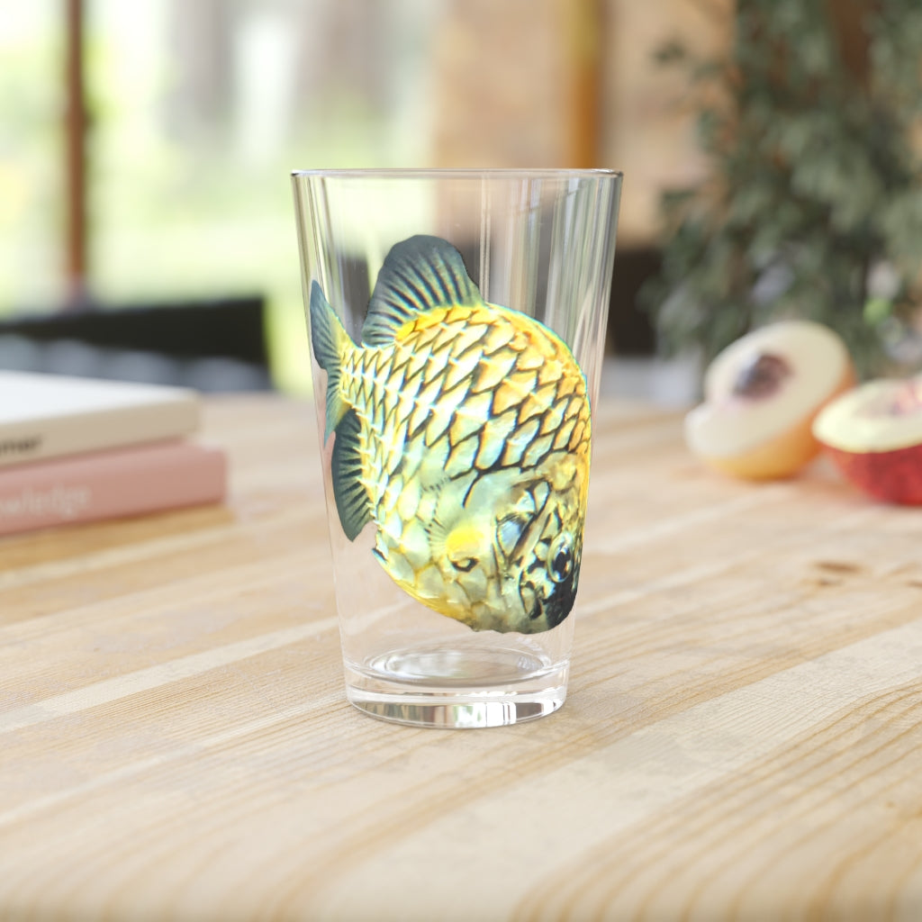 A clear 16oz pint glass featuring a pineapple fish design, perfect for personalized beverages.