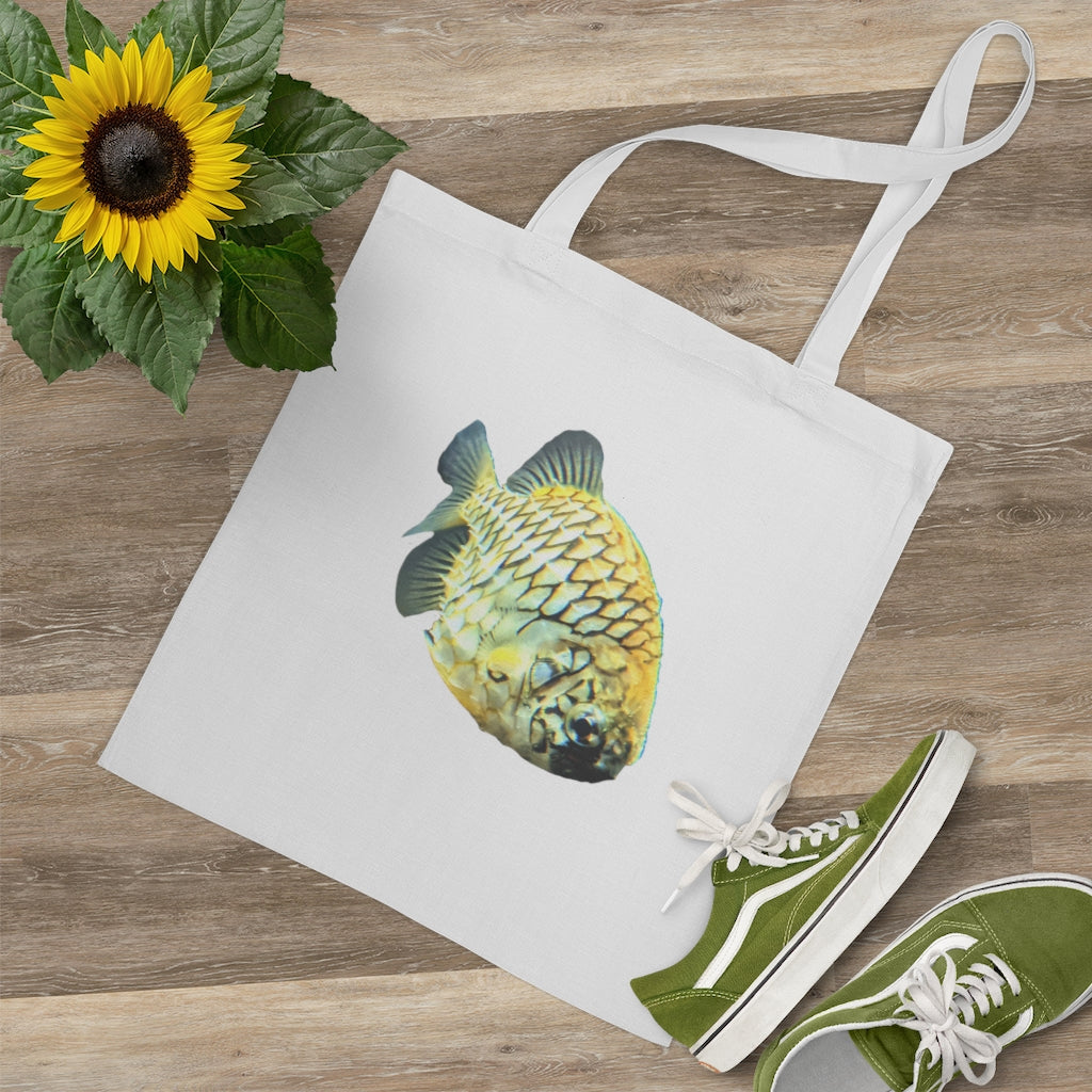 A vibrant Pineapple Fish Tote Bag made of 100% cotton, featuring long handles and cross stitching for added stability.