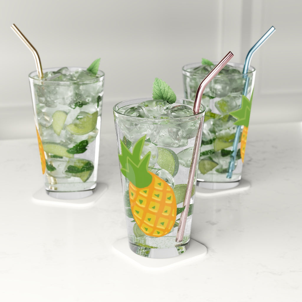 A clear 16oz Pineapple Pint Glass showcasing a vibrant pineapple design, perfect for personalized beverages.