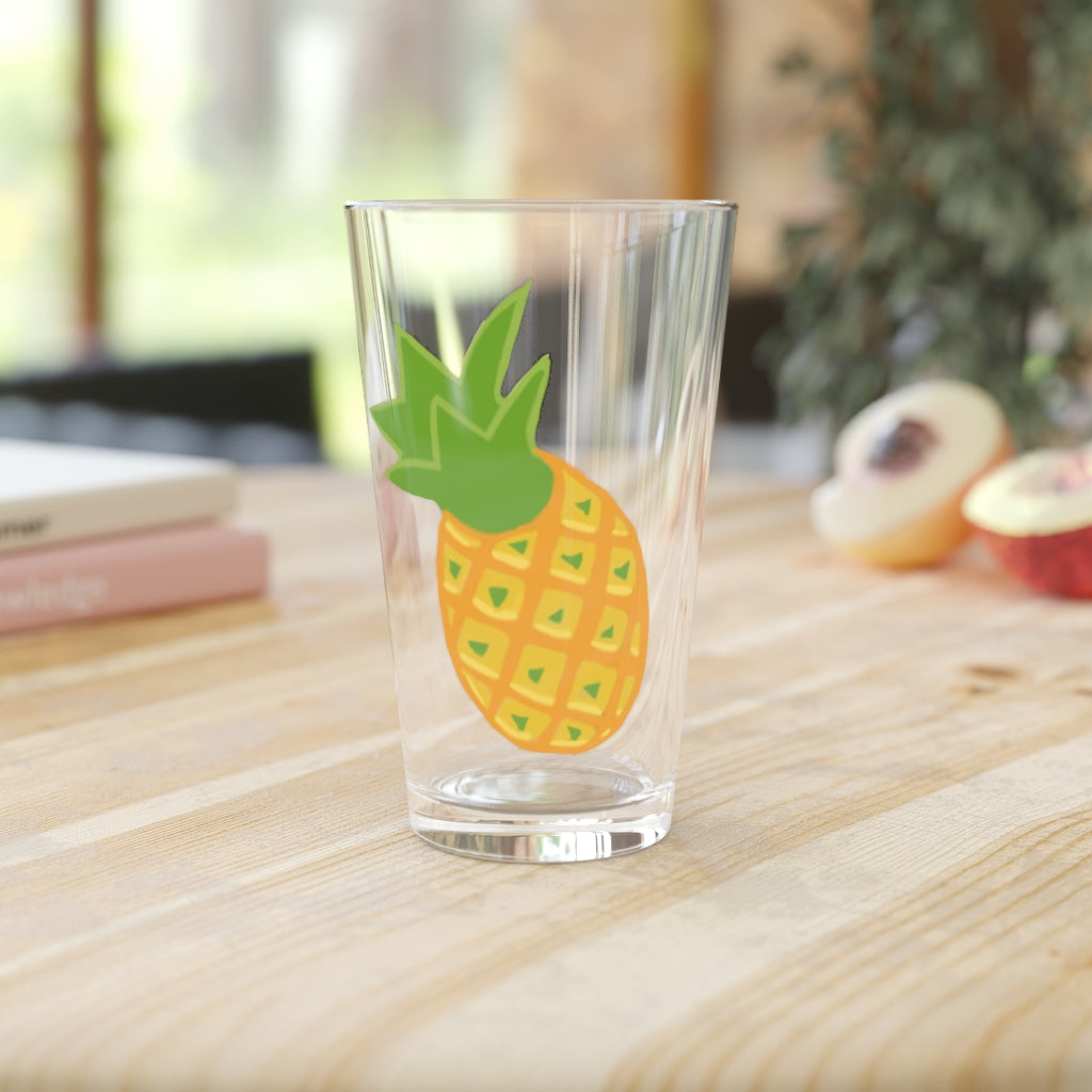 A clear 16oz Pineapple Pint Glass showcasing a vibrant pineapple design, perfect for personalized beverages.