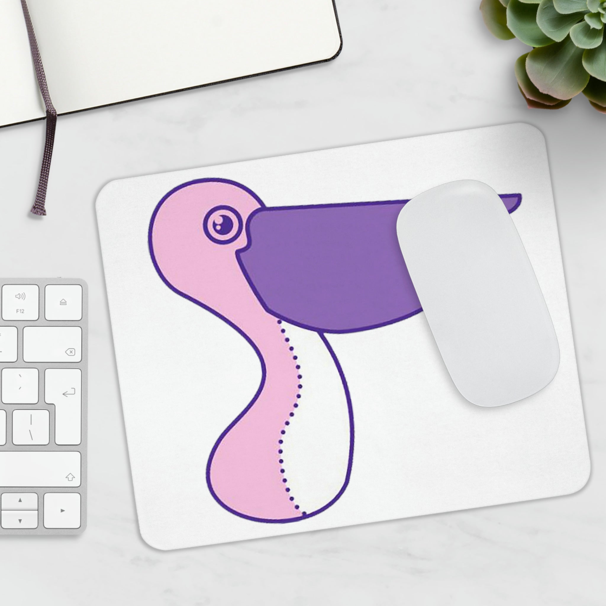 A vibrant pink and purple bird mouse pad featuring a colorful design, perfect for enhancing any workspace.