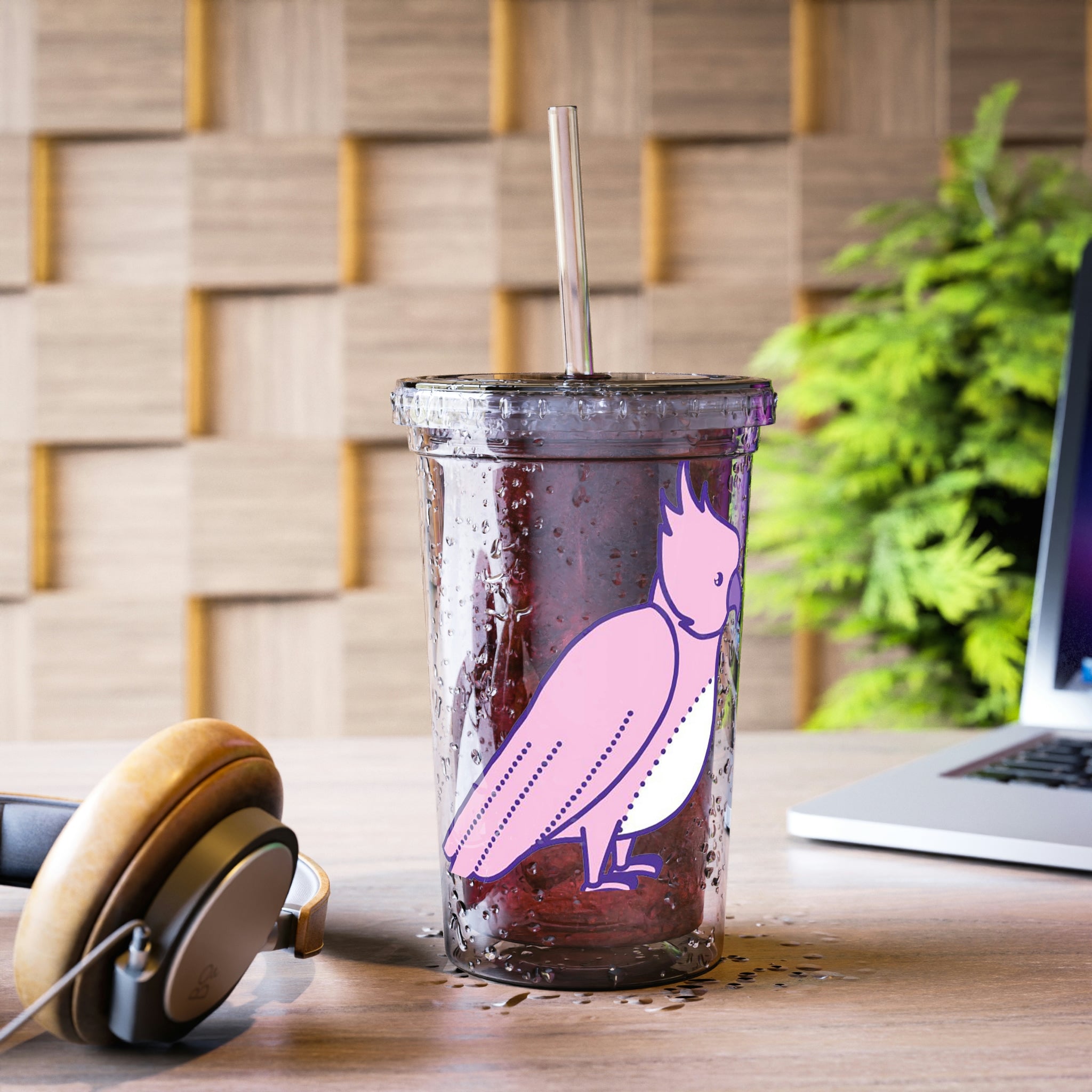 Pink and purple bird design on a stainless steel tumbler with a plastic straw, showcasing vibrant colors and a sleek finish.