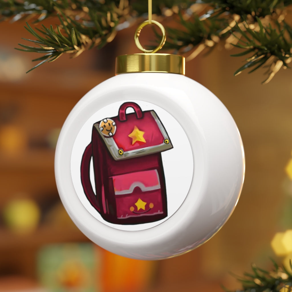 A beautiful pink ceramic Christmas ball ornament with a glossy finish, featuring a gold ribbon for hanging and a vintage design.