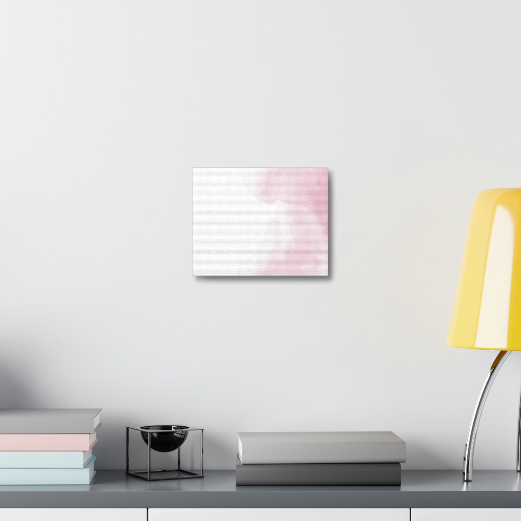 A vibrant stretched canvas featuring pink clouds, elegantly framed in wood, perfect for indoor decor.