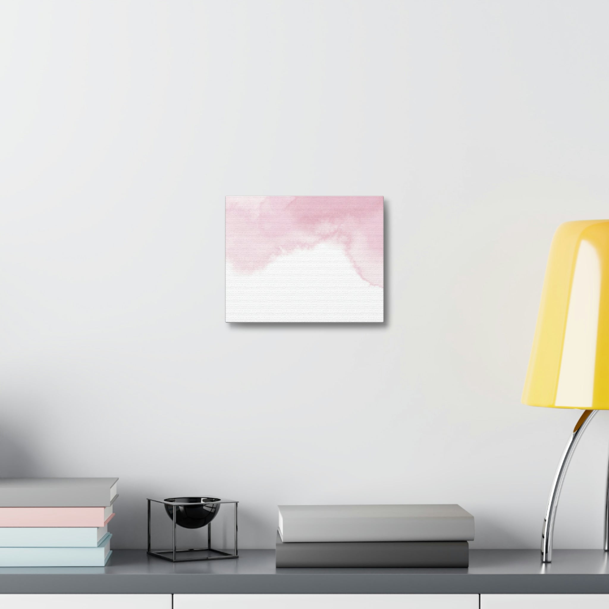 A beautiful stretched canvas featuring pink clouds, elegantly framed in wood, perfect for indoor decoration.