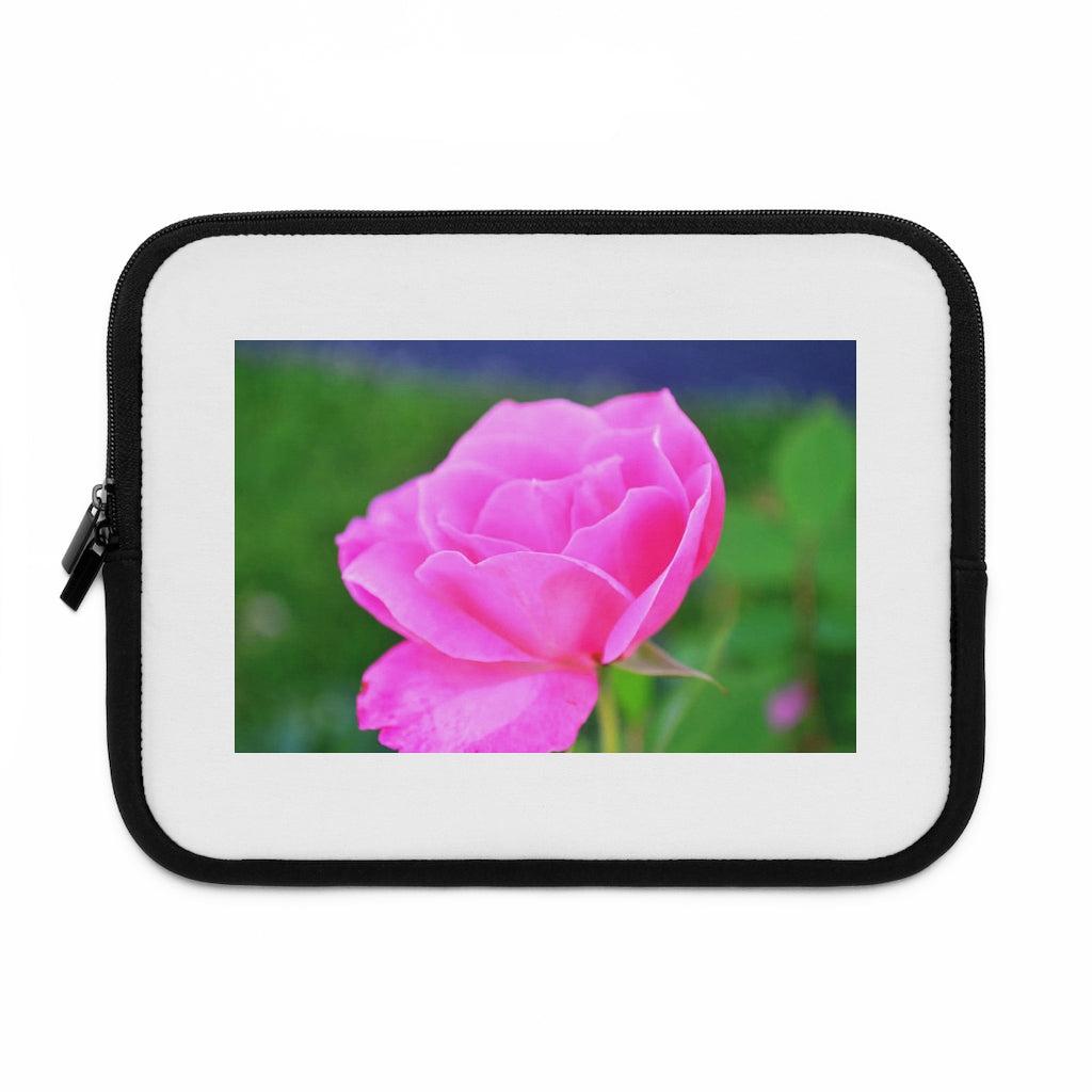 Pink Flower Laptop Sleeve featuring a vibrant floral design with a black polyester back, ideal for protecting laptops.