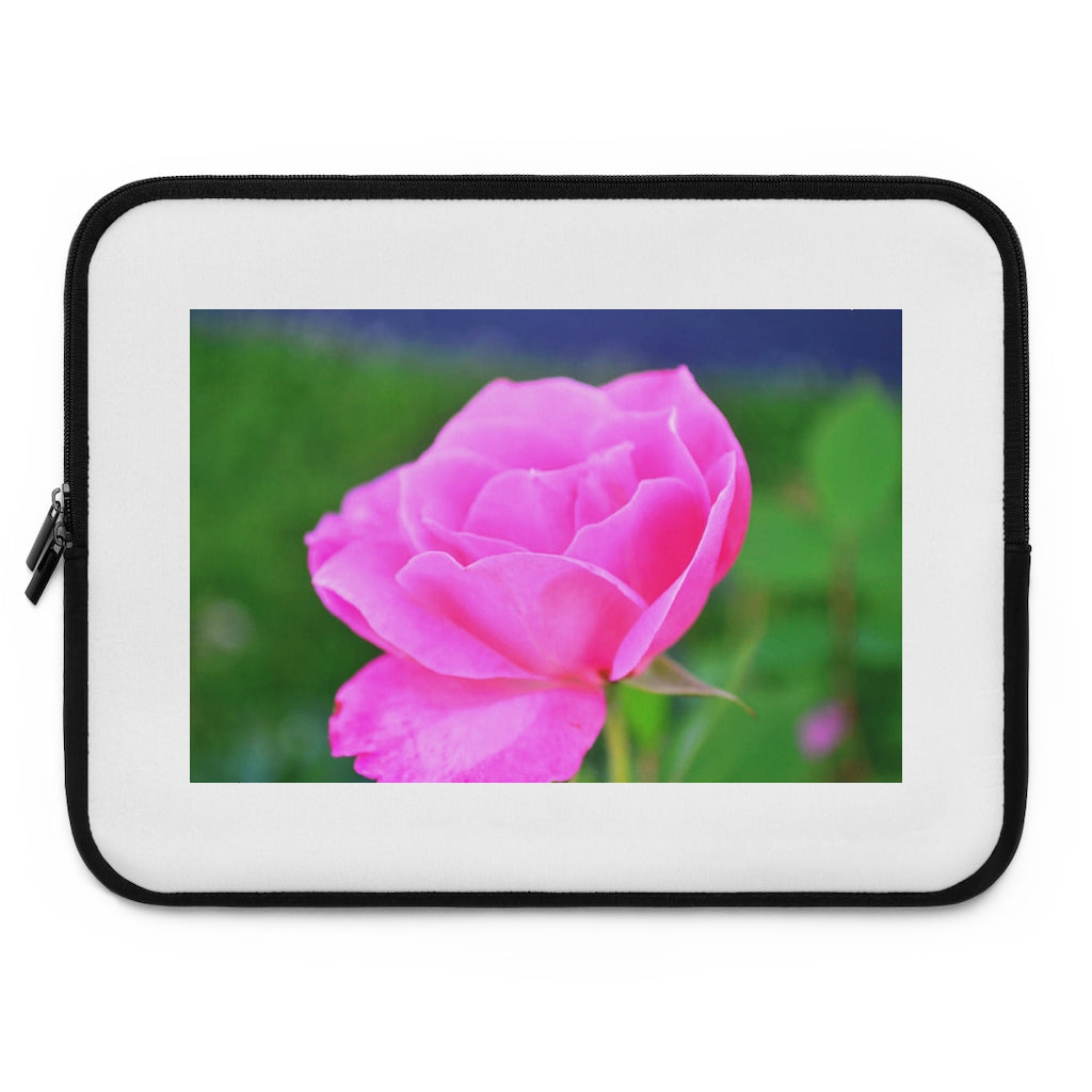 Pink Flower Laptop Sleeve featuring a vibrant floral design with a black polyester back, ideal for protecting laptops.