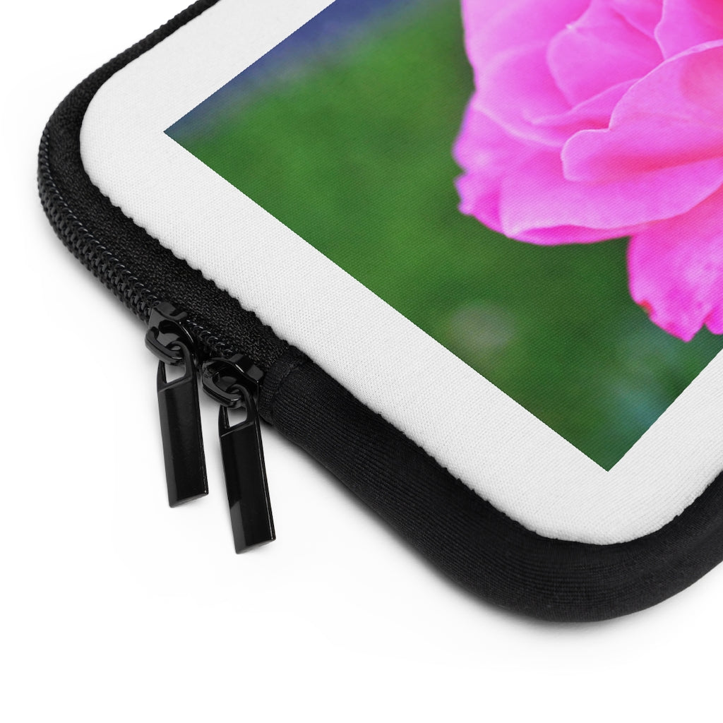 Pink Flower Laptop Sleeve featuring a vibrant floral design with a black polyester back, ideal for protecting laptops.