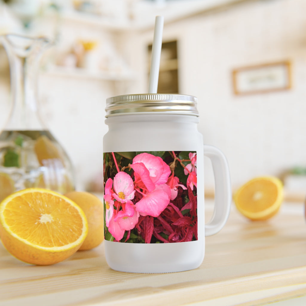 A stylish Pink Flower Mason Jar made of frosted glass, featuring a lid and straw, perfect for personalized beverages.