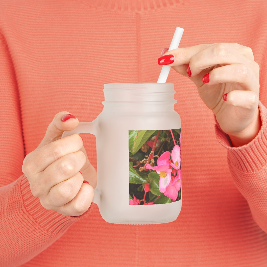 A stylish Pink Flower Mason Jar made of frosted glass, featuring a lid and straw, perfect for personalized beverages.