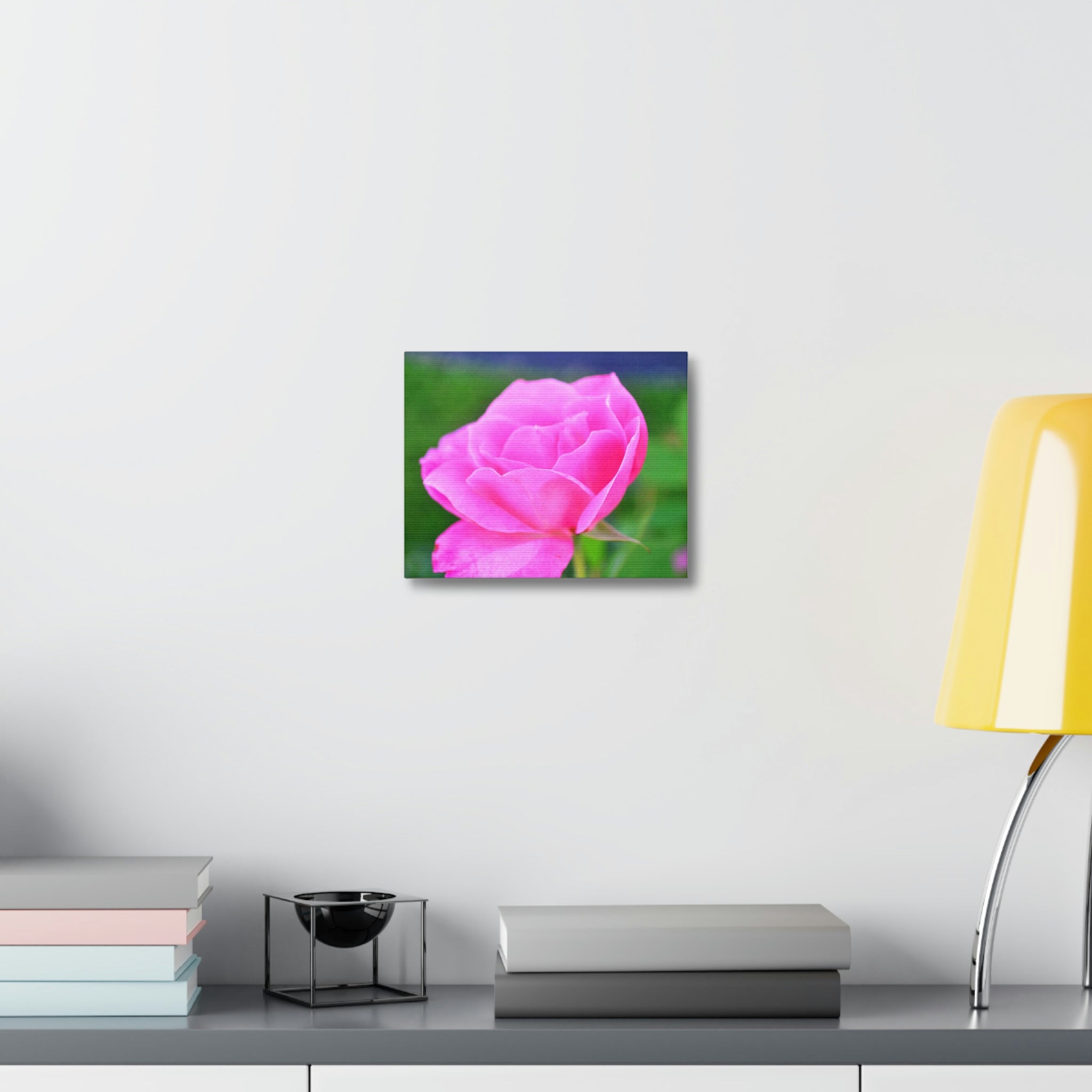 A vibrant pink flower stretched canvas art piece, elegantly framed and ready for indoor display.