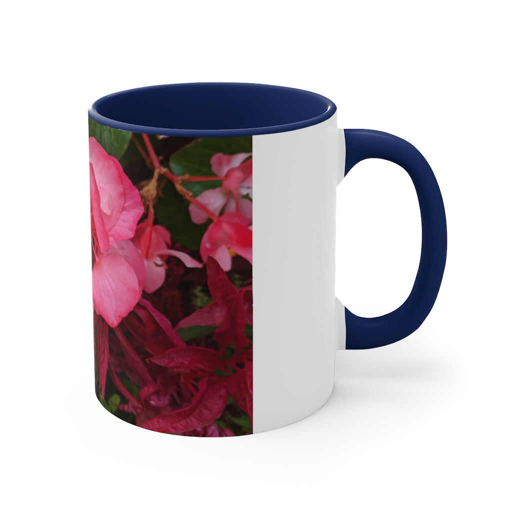 A vibrant pink flowers accent coffee mug with a white ceramic body and a contrasting colored interior and handle, showcasing its stylish design.