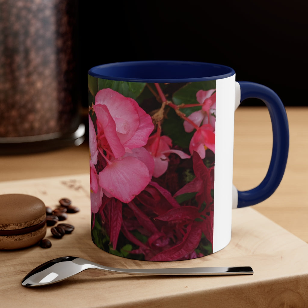 A vibrant pink flowers accent coffee mug with a white ceramic body and a contrasting colored interior and handle, showcasing its stylish design.