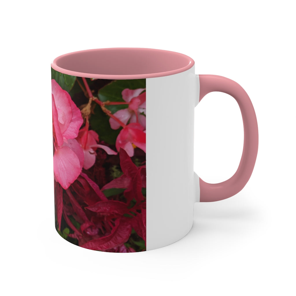 A vibrant pink flowers accent coffee mug with a white ceramic body and a contrasting colored interior and handle, showcasing its stylish design.