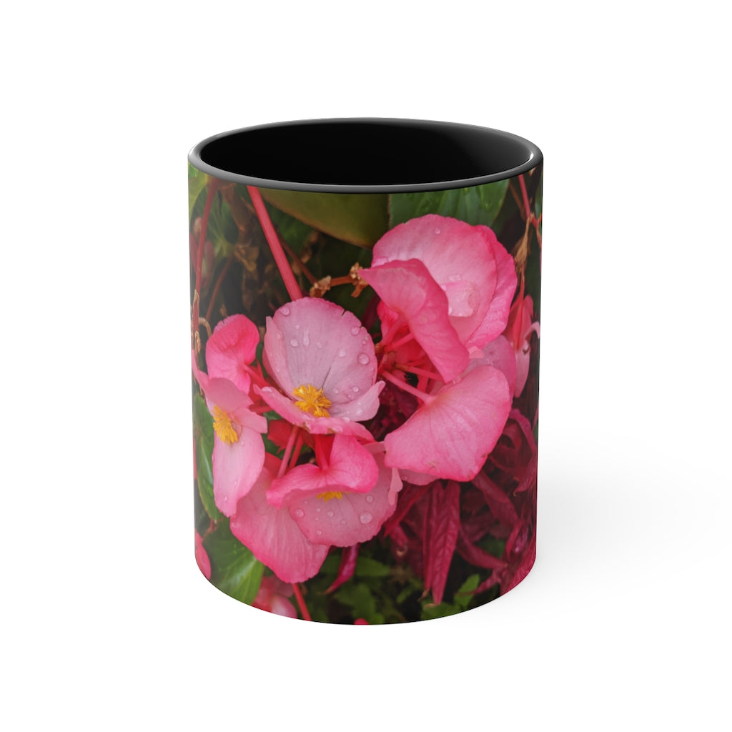 A vibrant pink flowers accent coffee mug with a white ceramic body and a contrasting colored interior and handle, showcasing its stylish design.