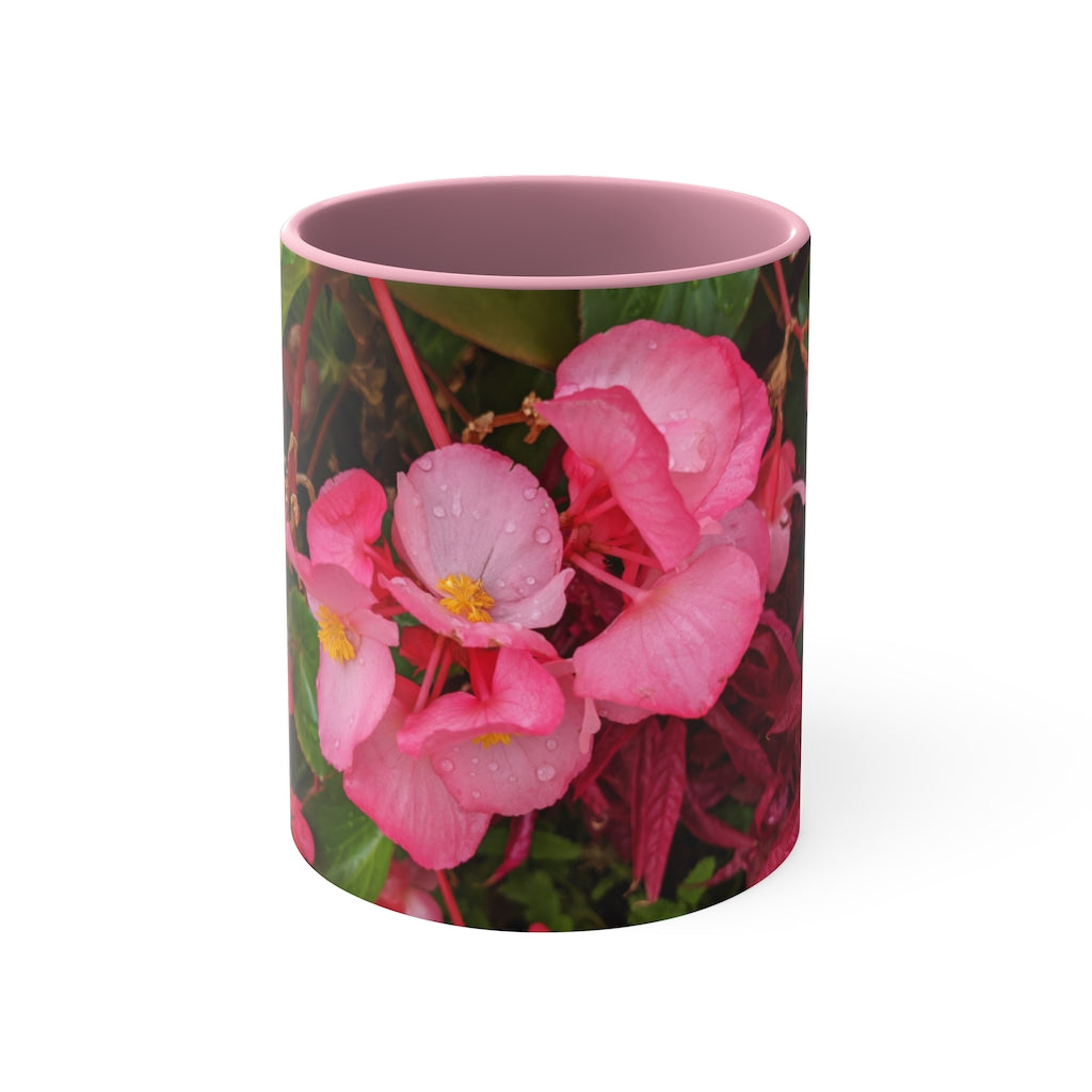 A vibrant pink flowers accent coffee mug with a white ceramic body and a contrasting colored interior and handle, showcasing its stylish design.